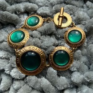 Vintage Coach Gold Tone Toggle Bracelet with Green Medallions.